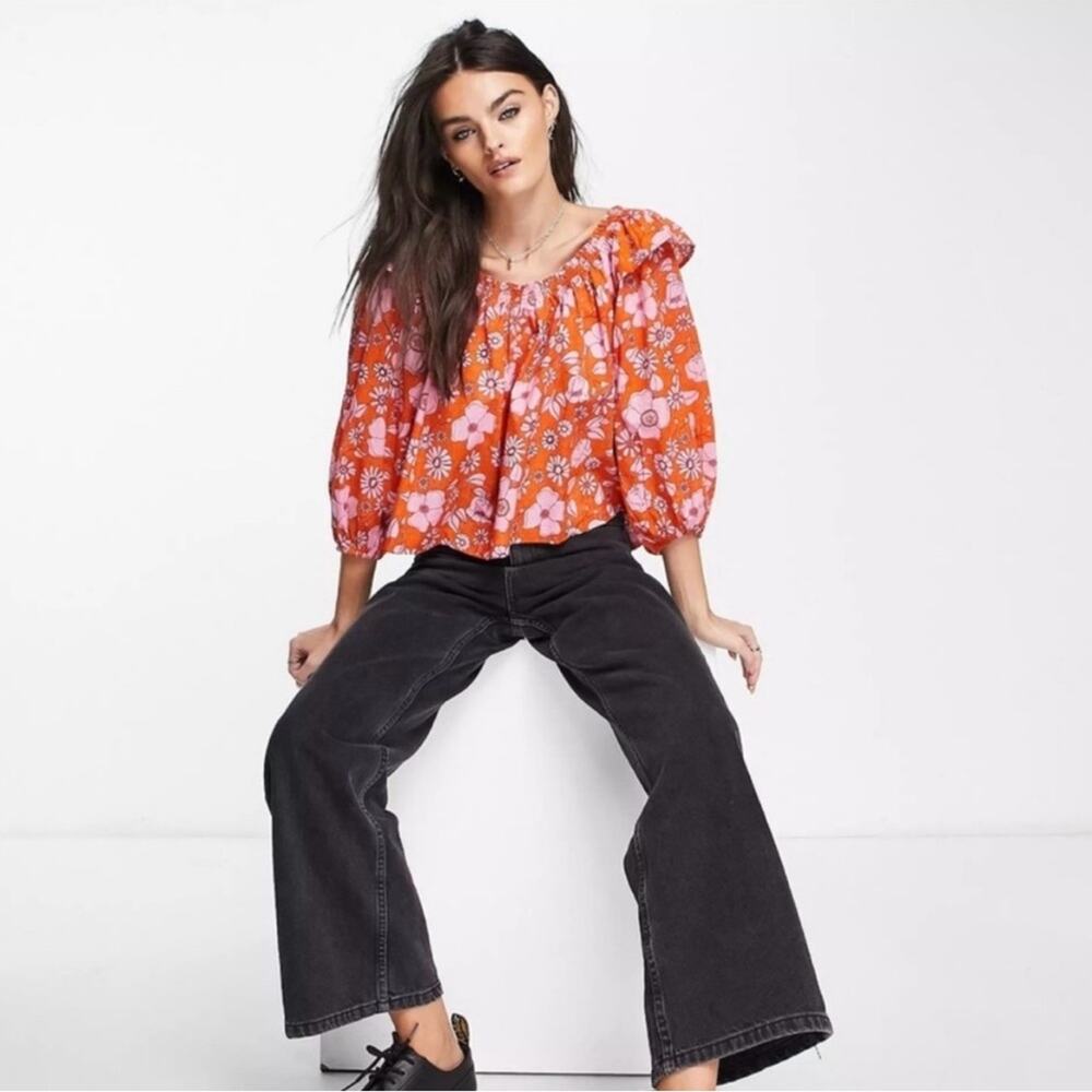 Free People Miss Daisy Floral Off Shoulder Top in Orange/Pink.
